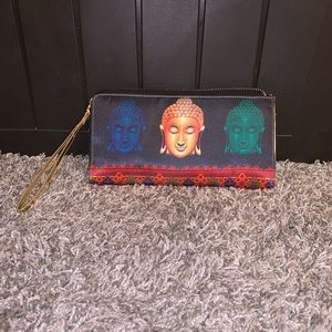 Buddha pattern wristlet clutch.